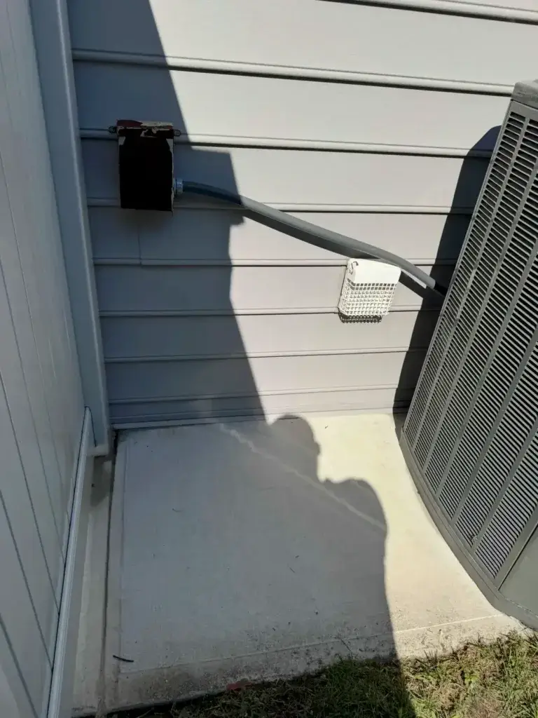 Concrete pad beside the house after cleaning